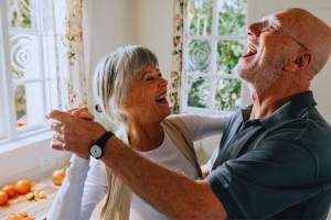 Senior couple laughing and dancing together. Dancing is a way to bring you closer together and improve communication in relationships.