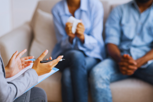 Couple in therapy sitting on a couch