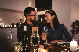 Couple eating dinner together at home