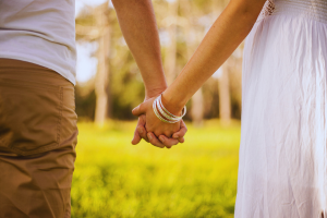 couple holding hands.