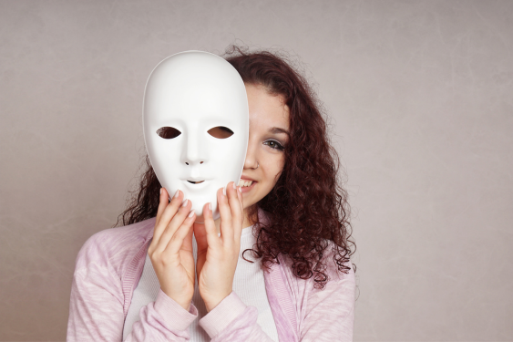 The woman takes off her mask and enjoys the joy of being herself