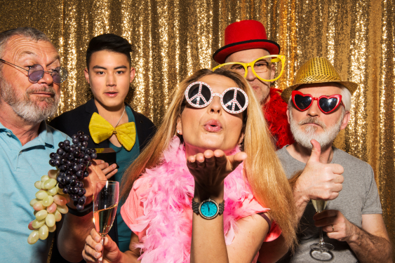 Five friends dressed in party clothes and enjoying the party