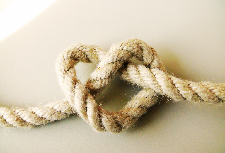Knotted heart shape shows trust