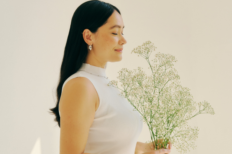 A woman practices self-compassion by treating herself with kindness and understanding