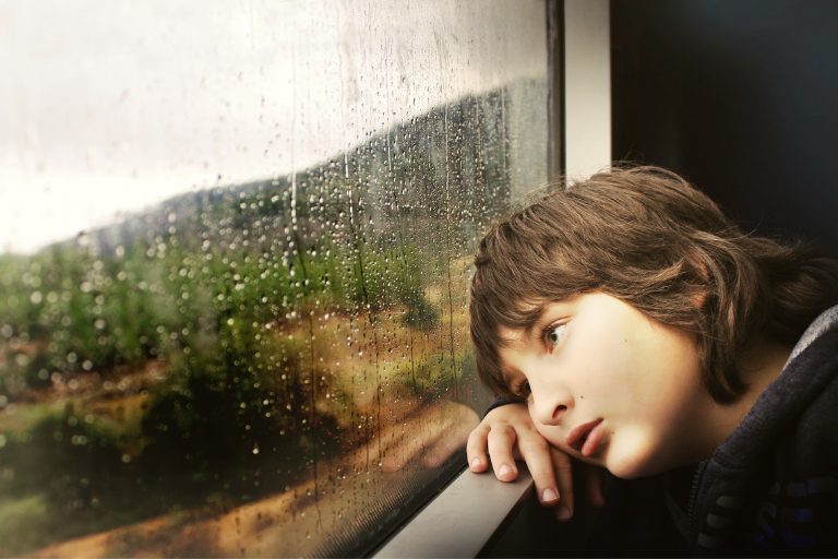 emotional-resilience-1 The little boy sitting by the train window is haunted by family trauma.