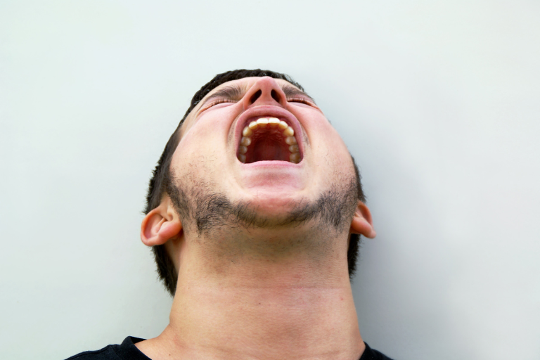 slfelovematters-Blog-Images-1 A man is suffering from the trauma of his inner child and is screaming uncontrollably.
