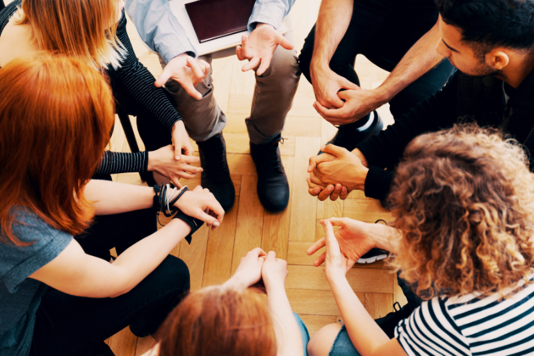 A group of people seeks support by revisiting self-care practices