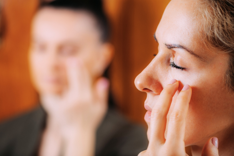 A man and woman are using EFT Tapping into Healing